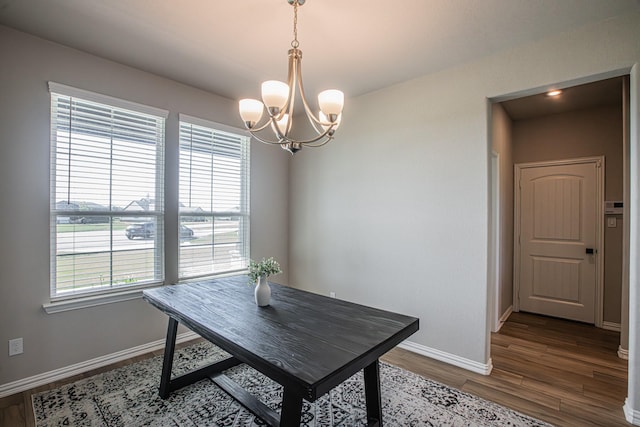 146 Chester Rd, Springtown, TX 76082 - dining space featuring a chandelier, healthy amount of natural light, wood finished floors, and baseboards