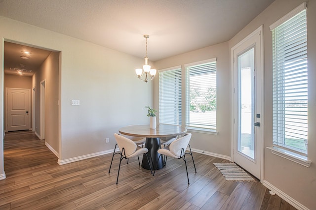 146 Chester Rd, Springtown, TX 76082 - dining space featuring wood finished floors, plenty of natural light, and baseboards