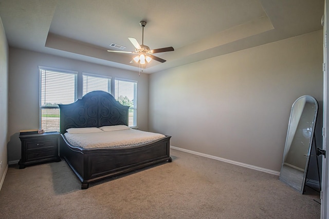 146 Chester Rd, Springtown, TX 76082 - carpeted bedroom with a raised ceiling, baseboards, and ceiling fan