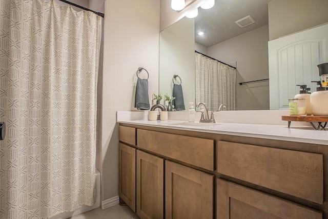 146 Chester Rd, Springtown, TX 76082 - full bath with vanity, tile patterned floors, and shower / bath combo with shower curtain