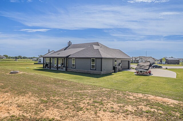 146 Chester Rd, Springtown, TX 76082 - view of side of property with an attached garage, concrete driveway, and a lawn
