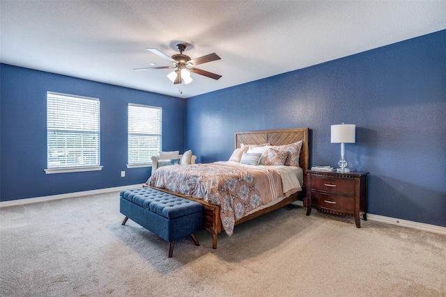 bedroom with carpet, baseboards, and ceiling fan