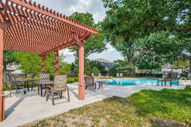 view of swimming pool featuring a pergola, fence, a patio, and outdoor dining area