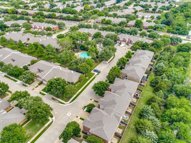 aerial perspective of suburban area with a pool