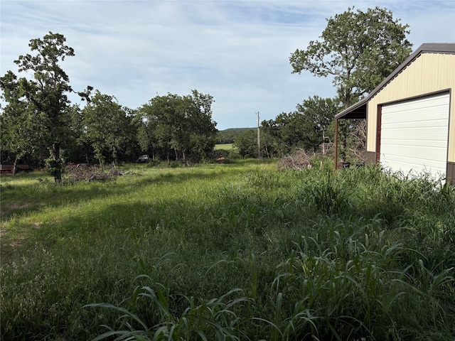 1017 Miller Dr, Mineral Wells, TX 76067 - view of yard featuring a garage