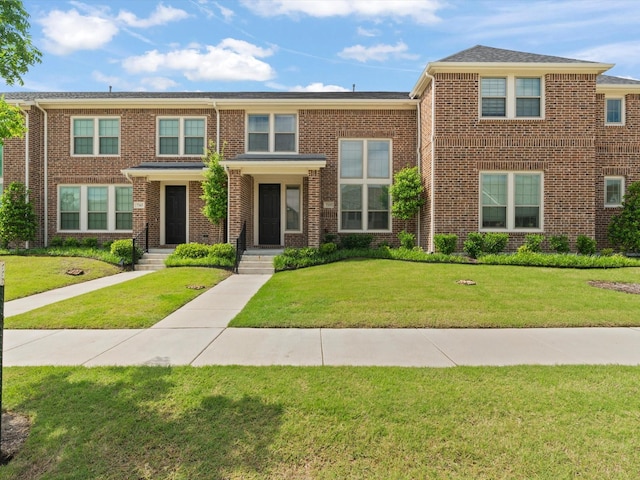 7335 Panicum Dr, Frisco, TX 75033 - view of property with brick siding and a front lawn