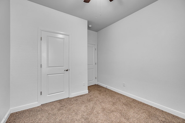 516 Smart Strike Trl, Granbury, TX 76049 - unfurnished bedroom with carpet, baseboards, and a ceiling fan