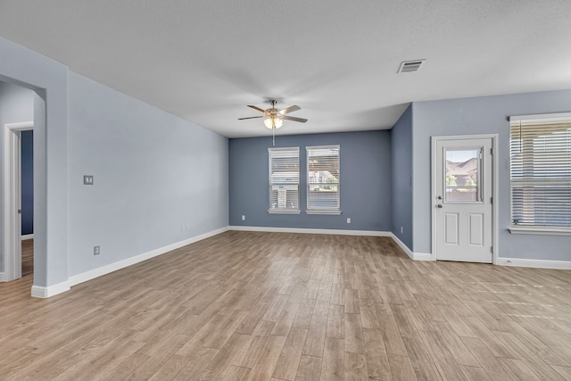 516 Smart Strike Trl, Granbury, TX 76049 - unfurnished living room featuring ceiling fan, light wood finished floors, and baseboards