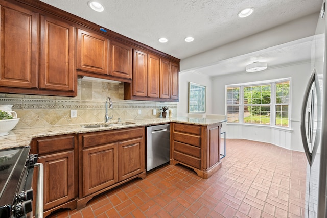 7609 Spring Valley Rd, Dallas, TX 75254 - kitchen with appliances with stainless steel finishes, a sink, brick flooring, decorative backsplash, and recessed lighting