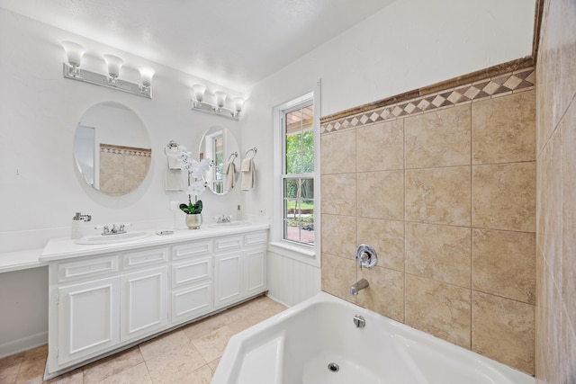 7609 Spring Valley Rd, Dallas, TX 75254 - full bath with a tub to relax in, tile patterned floors, and double vanity