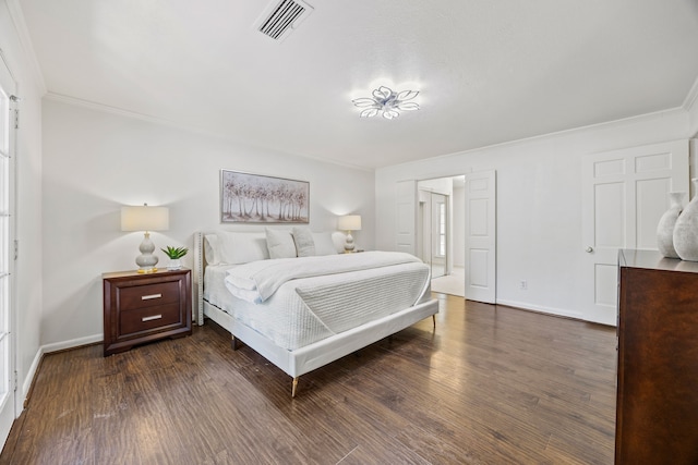 7609 Spring Valley Rd, Dallas, TX 75254 - bedroom with ornamental molding, baseboards, and dark wood-type flooring