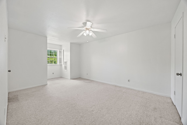 7609 Spring Valley Rd, Dallas, TX 75254 - unfurnished room with a ceiling fan, light carpet, and baseboards