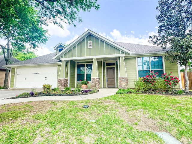 517 N 2nd St, Midlothian, TX 76065 - craftsman-style house with concrete driveway, a garage, stone siding, and a front lawn