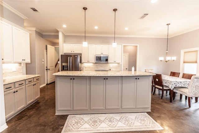 517 N 2nd St, Midlothian, TX 76065 - kitchen with stainless steel appliances, concrete flooring, decorative backsplash, a kitchen island, and white cabinetry