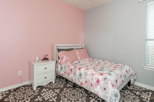517 N 2nd St, Midlothian, TX 76065 - bedroom featuring baseboards and multiple windows