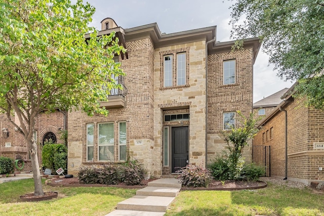 670 Bridge St, Coppell, TX 75019 - view of front facade with brick siding, stone siding, and a front yard