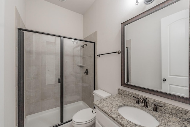 670 Bridge St, Coppell, TX 75019 - bathroom featuring vanity, toilet, and a stall shower