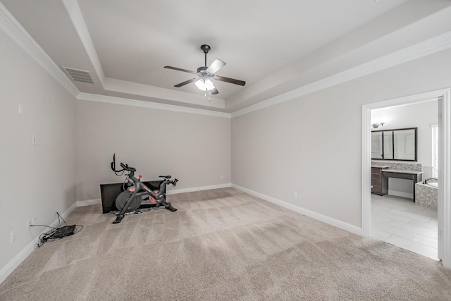 670 Bridge St, Coppell, TX 75019 - exercise area featuring a raised ceiling, ceiling fan, light carpet, baseboards, and ornamental molding