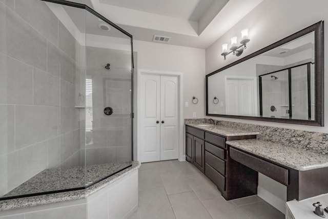 670 Bridge St, Coppell, TX 75019 - full bathroom with a stall shower, tile patterned floors, and vanity
