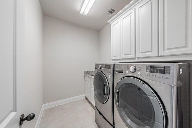 670 Bridge St, Coppell, TX 75019 - washroom with cabinet space, washing machine and dryer, and baseboards