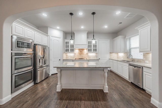 670 Bridge St, Coppell, TX 75019 - kitchen featuring appliances with stainless steel finishes, a sink, white cabinets, a center island, and recessed lighting