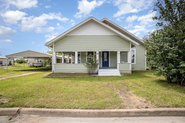 301 Sycamore St, Bardwell, TX 75101 - view of front of home featuring a porch, a front yard, a detached carport, and driveway