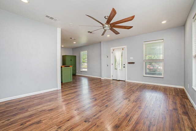 301 Sycamore St, Bardwell, TX 75101 - unfurnished living room with a ceiling fan, dark wood-style flooring, recessed lighting, and baseboards