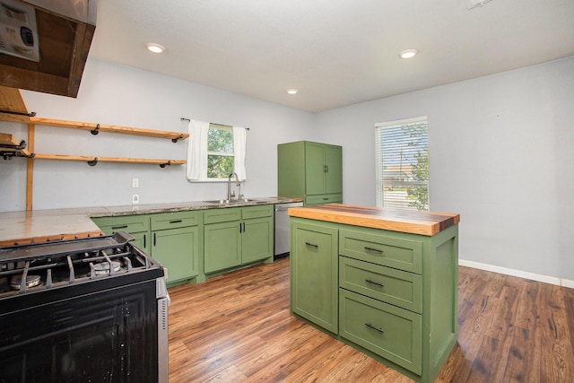301 Sycamore St, Bardwell, TX 75101 - kitchen with green cabinetry, range with gas stovetop, a sink, butcher block countertops, and light wood finished floors