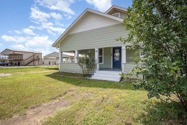 301 Sycamore St, Bardwell, TX 75101 - view of front of property featuring covered porch and a front lawn