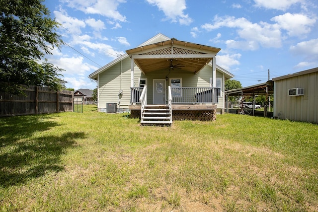 301 Sycamore St, Bardwell, TX 75101 - back of property with ceiling fan, cooling unit, a wall mounted AC, and a deck