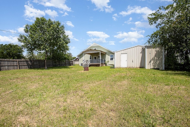 301 Sycamore St, Bardwell, TX 75101 - view of yard featuring an outdoor structure and a wooden deck