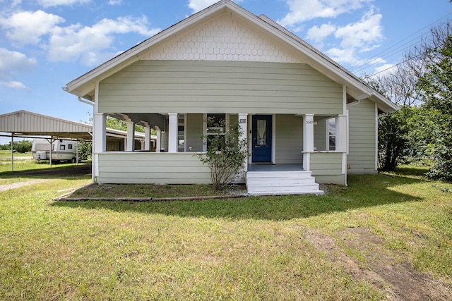 301 Sycamore St, Bardwell, TX 75101 - bungalow-style home featuring covered porch, a front lawn, and a detached carport