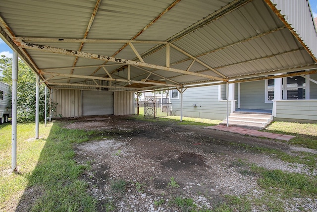 301 Sycamore St, Bardwell, TX 75101 - view of parking / parking lot featuring a carport and a garage
