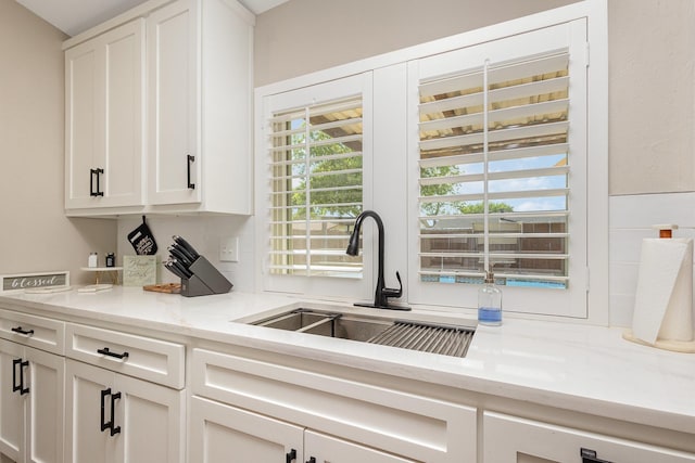3105 Kensington Dr, Mesquite, TX 75150 - kitchen featuring a sink and white cabinetry
