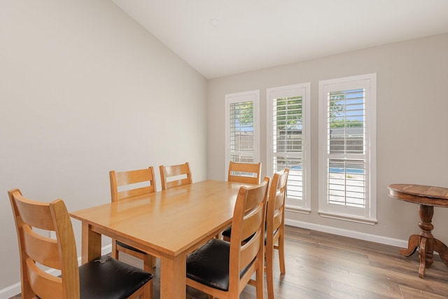 3105 Kensington Dr, Mesquite, TX 75150 - dining room with baseboards, wood finished floors, and lofted ceiling