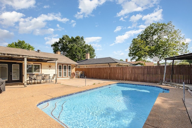 3105 Kensington Dr, Mesquite, TX 75150 - view of pool with a fenced backyard, a patio, and french doors