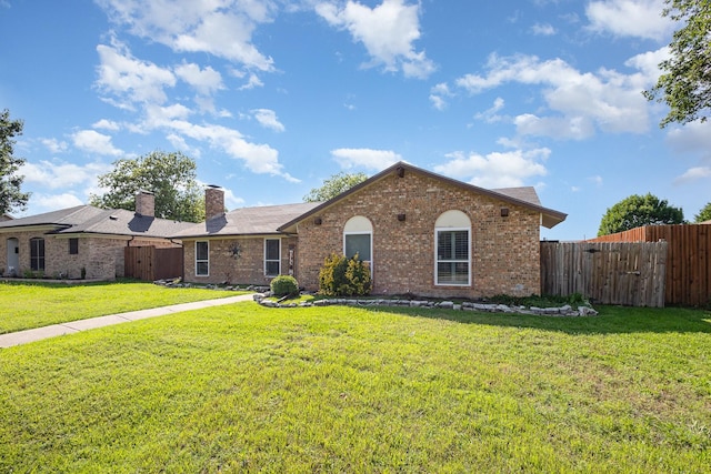 3105 Kensington Dr, Mesquite, TX 75150 - single story home with brick siding and a chimney