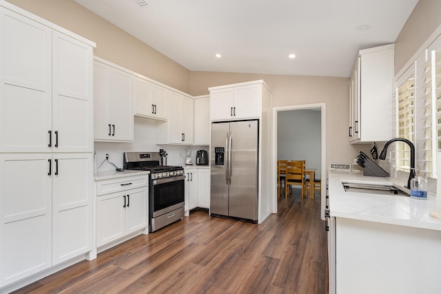 3105 Kensington Dr, Mesquite, TX 75150 - kitchen with stainless steel appliances, a sink, dark wood-style flooring, recessed lighting, and white cabinets