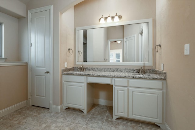 3900 Plum Vista Pl, Arlington, TX 76005 - full bathroom with double vanity, baseboards, tile patterned floors, and a ceiling fan