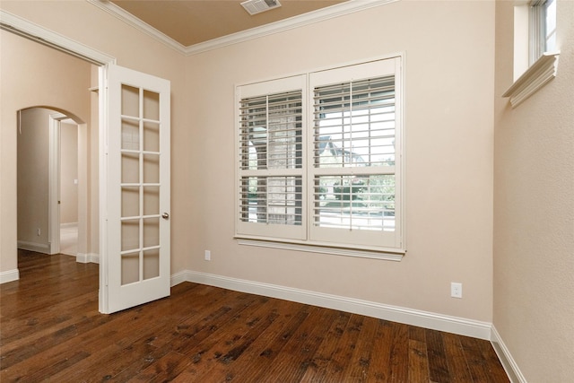 3900 Plum Vista Pl, Arlington, TX 76005 - unfurnished room with arched walkways, ornamental molding, dark wood-style floors, and baseboards