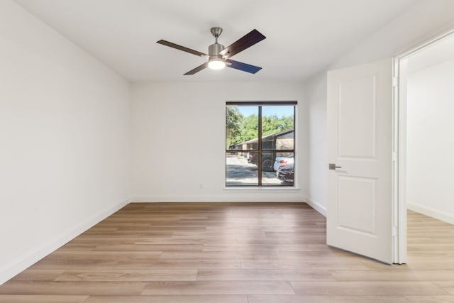 7525 Holly Hill Dr Unit 17, Dallas, TX 75231 - spare room with ceiling fan, light wood finished floors, and baseboards