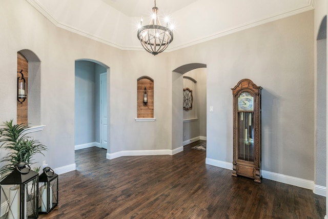 1061 Circle J Trl, Prosper, TX 75078 - unfurnished dining area with arched walkways, a chandelier, crown molding, dark wood-type flooring, and baseboards