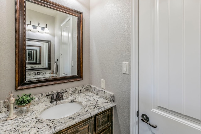 1061 Circle J Trl, Prosper, TX 75078 - bathroom with a textured wall and vanity