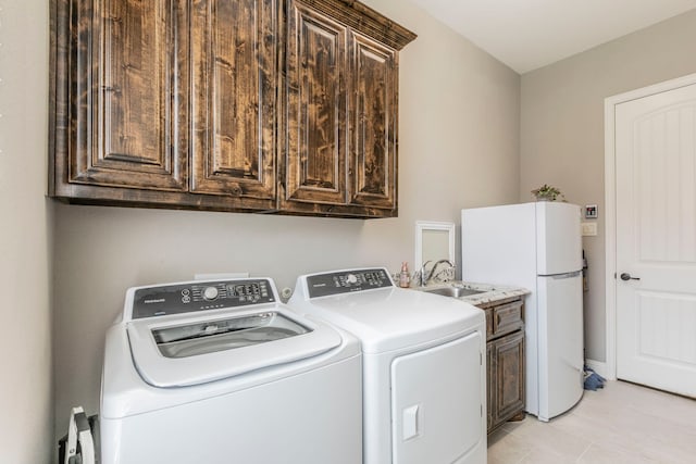 1061 Circle J Trl, Prosper, TX 75078 - laundry room with washer and dryer, cabinet space, and light tile patterned floors