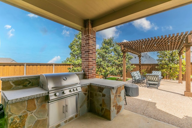 1061 Circle J Trl, Prosper, TX 75078 - view of patio / terrace with area for grilling, a fenced backyard, a pergola, and exterior kitchen