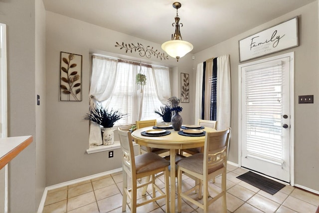 1942 Garrison Way, Garland, TX 75040 - dining room featuring light tile patterned floors and baseboards