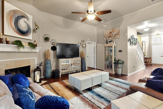 1942 Garrison Way, Garland, TX 75040 - living area featuring wood finished floors, a ceiling fan, stairway, a fireplace, and baseboards