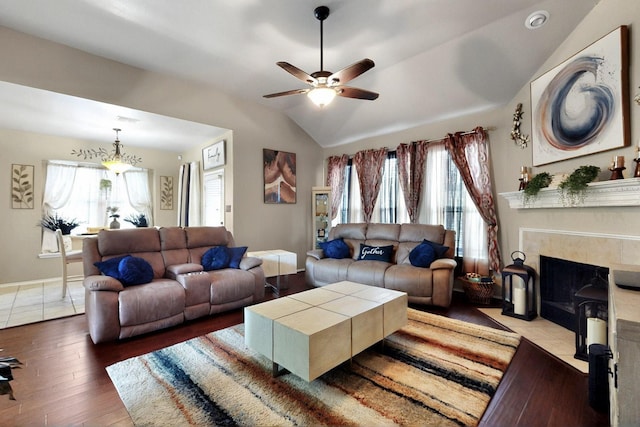 1942 Garrison Way, Garland, TX 75040 - living area featuring a ceiling fan, healthy amount of natural light, hardwood / wood-style floors, vaulted ceiling, and a fireplace
