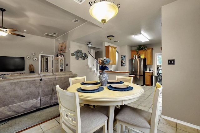 1942 Garrison Way, Garland, TX 75040 - dining room with light tile patterned flooring, stairway, a ceiling fan, and baseboards