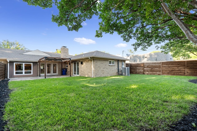 3644 Courtdale Dr, Farmers Branch, TX 75234 - rear view of house featuring french doors, central AC unit, a chimney, a patio area, and brick siding